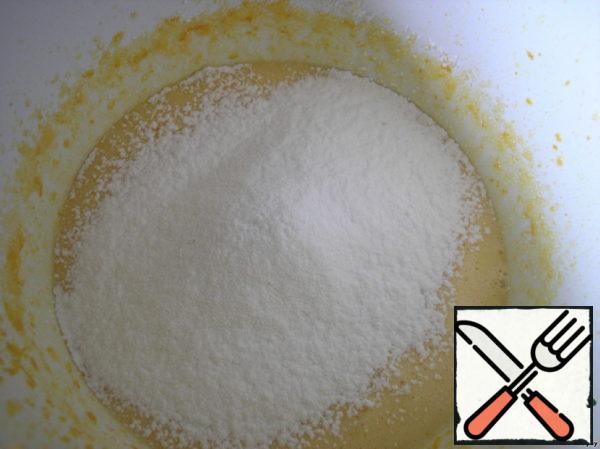 Sift flour with baking powder on top and gently stir it with a metal spoon.