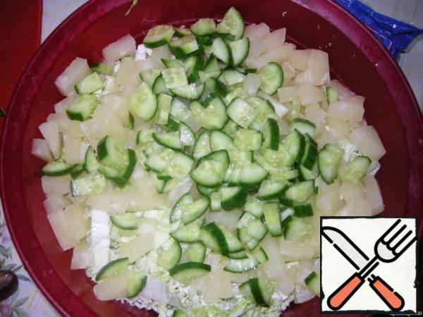 Add the sliced cucumber.
