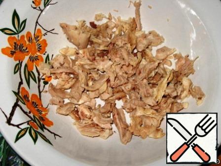 Chicken meat cut into small pieces.