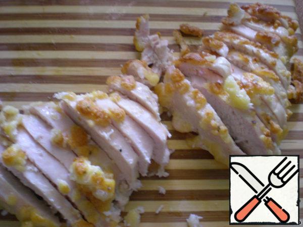 The finished meat is slightly cooled and cut into plates.
