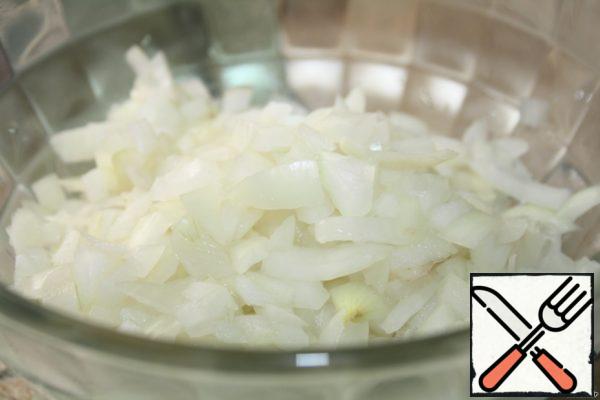 Onions cut into cubes, scalded with boiling water.