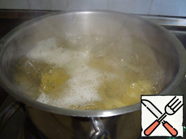 Peel the potatoes and send them to boiling salted water. Cook until tender.