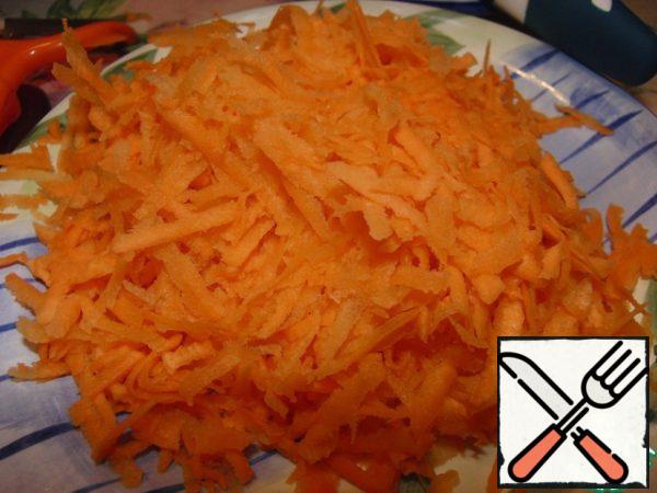 Grate the carrots.