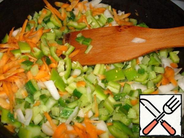 To cucumbers, when they let the juice and it is half evaporated, add onions, carrots, pepper. Simmer over medium heat (I didn't cover it) until the vegetables are soft and the liquid almost evaporates.
