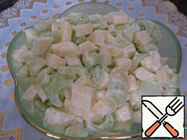 Cut the Apple and celery mix, season with mayonnaise. All, salad is ready.