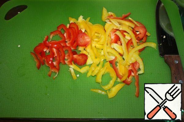Chop the bell peppers into strips.