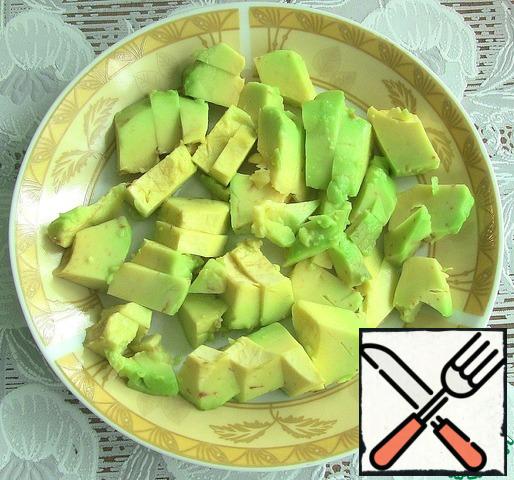 Avocado peel and cut into cubes as well.