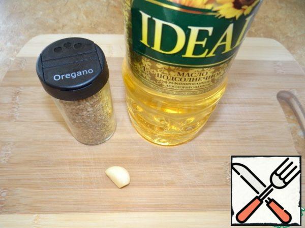 Mix oil, garlic (chopped) and oregano.