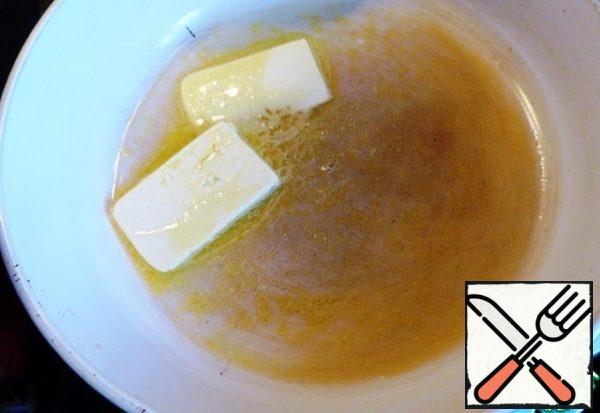 Heat 50 grams of butter in a frying pan.
