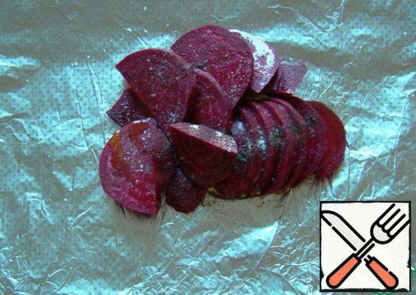 Wash, peel, and slice the beets. Season with salt, pepper and pour 1 tablespoon of vegetable oil.
Wrap it in foil and send it to a preheated 200 degree oven.