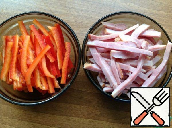Pepper and ham cut into thin strips.

