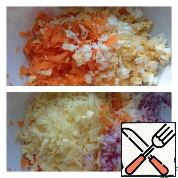 Wash, peel and grate the carrots on a medium grater. Also grate boiled eggs on a coarse grater. Add finely chopped onion and cheese grated on a medium grater to the salad bowl.
