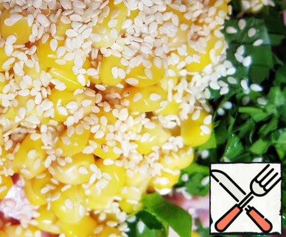 Add corn and sesame seeds.