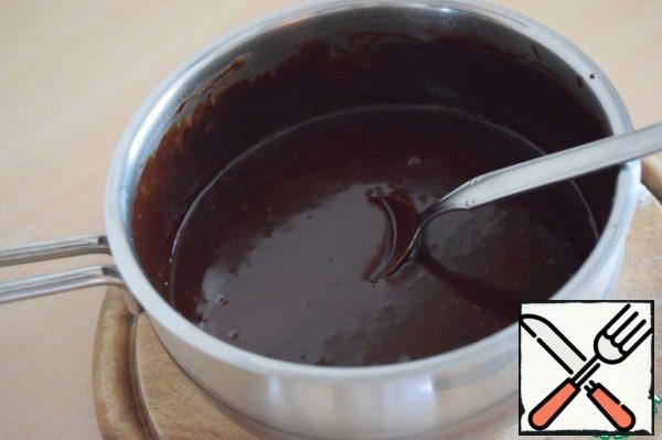 Add mascarpone to the cooled chocolate mixture and beat on high speed with a mixer until fluffy.
