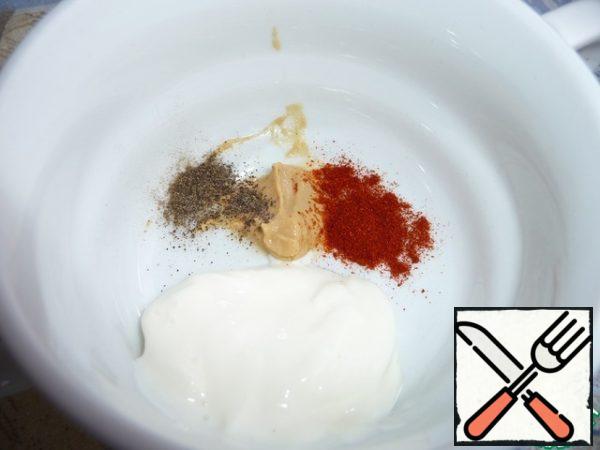In a Cup mix sour cream, mustard, salt, pepper. With salt be careful.