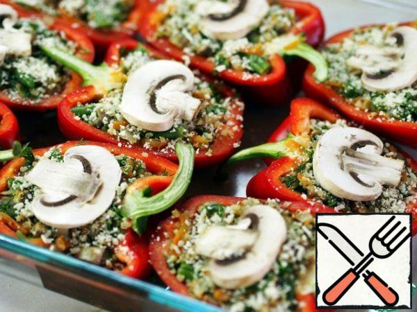 Preheat the oven to 200 degrees.
We fill our peppers with stuffing and put them in a preheated oven for 35-40 minutes, until the pepper is soft.
However, I had a great desire to eat them directly without baking. I think you can serve these peppers raw as a cold snack.