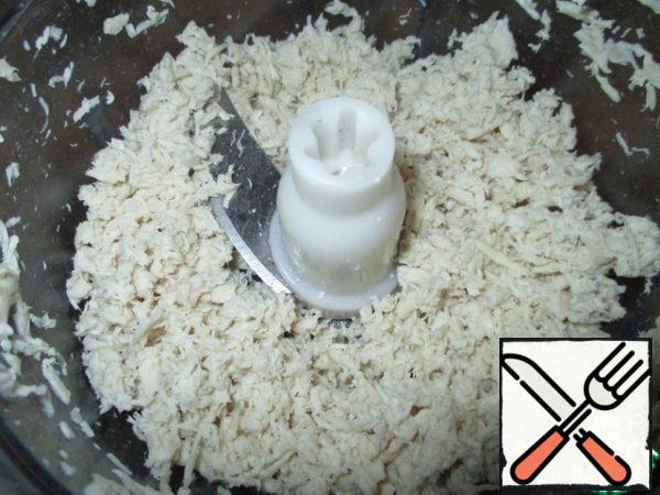 Boiled chicken fillet is not cut into small pieces and crushed in a blender.
