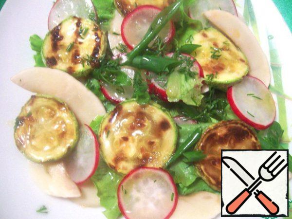 Put the salad mixture with radishes on serving plates, then mushrooms and zucchini. Pour over the dressing.
