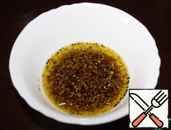 Add the herbs, soy sauce and squeezed lemon to the oil.
