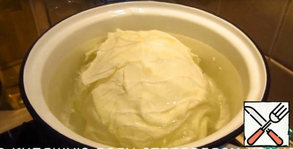 Cabbage whole head send in a large pot of boiling water for 15 minutes. The leaves are perfectly separated.