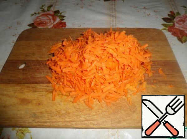 Grate the carrots.
