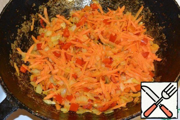 Add grated carrots and fry for another half a minute.