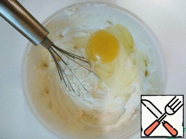 Then beat in one egg and beat well with a whisk.
