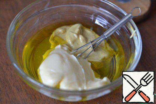 In a separate bowl, mix olive oil, mustard, mayonnaise, salt and pepper.