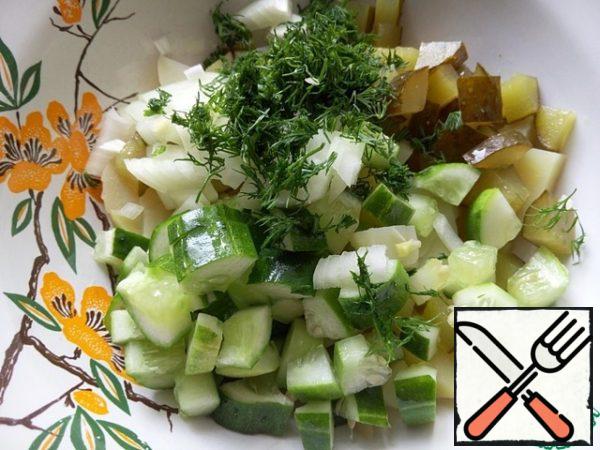 Add chopped dill to the salad.

