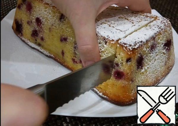 Send baked cake with cottage cheese and black currant in the oven at 170 degrees for 1 hour.
When cake cools down, get it out of the mold and decorate with powdered sugar.