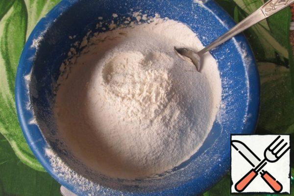 Add the flour sifted with baking powder to the dough.
