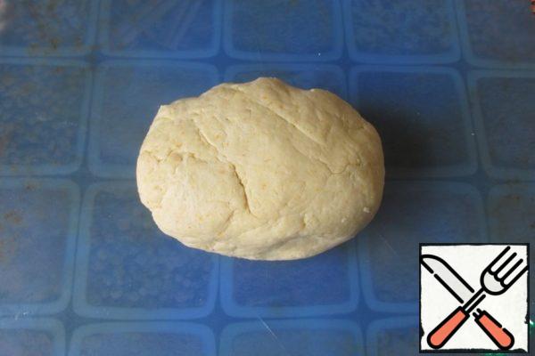 Knead a homogeneous, slightly sticky dough. It is impossible to knead the dough for a long time, only 1-2 minutes.
