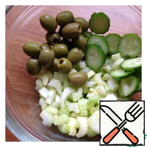 Cucumber cut into thin rings, celery small cubes. Add olives.