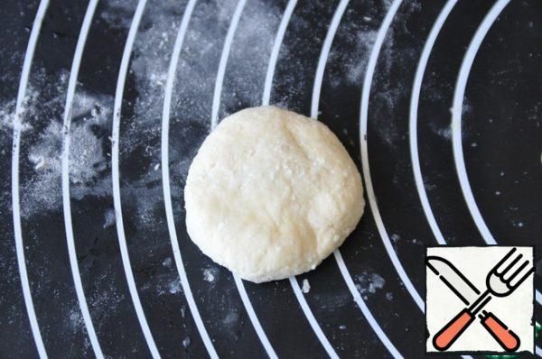 Pinch the edges, lay the seam down on a baking sheet.
