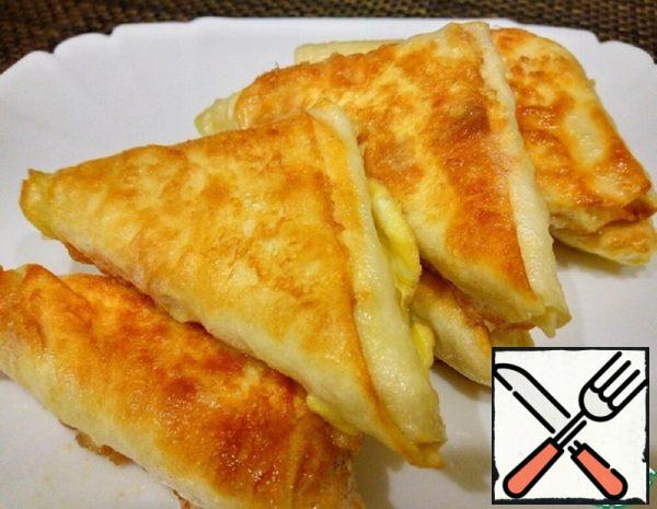 Triangles of Pita Bread with Melted Cheese Recipe