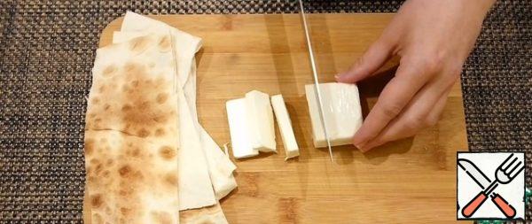 Cut the melted cheese into 7 pieces.
