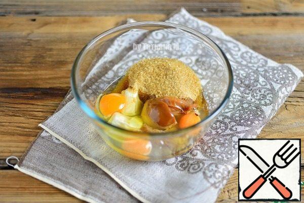 In a bowl, mix eggs, sugar, condensed milk and butter.
