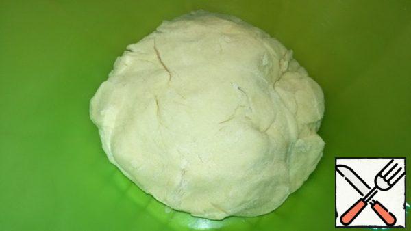 Add the sifted flour and knead the dough. Flour may take a little more or less. Wrap the dough in plastic wrap and refrigerate for 30-40 minutes.
