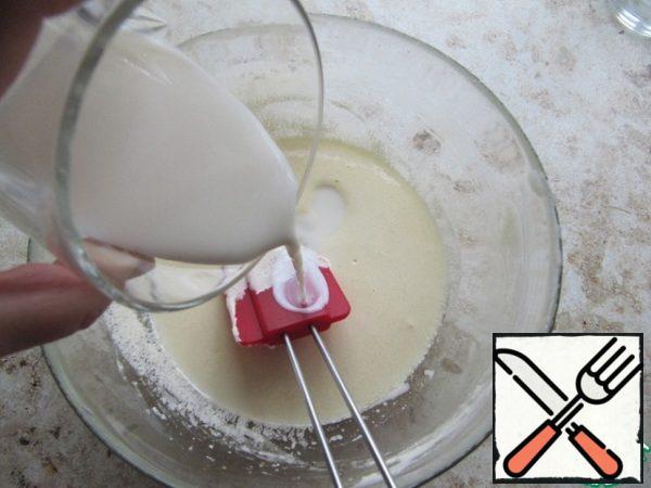 Then pour in the milk in several steps, beat with a mixer. Pour in the sifted flour, beat with a mixer at low speed.
