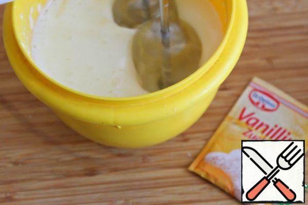 Beat egg yolks with sugar and vanilla sugar with a mixer.
