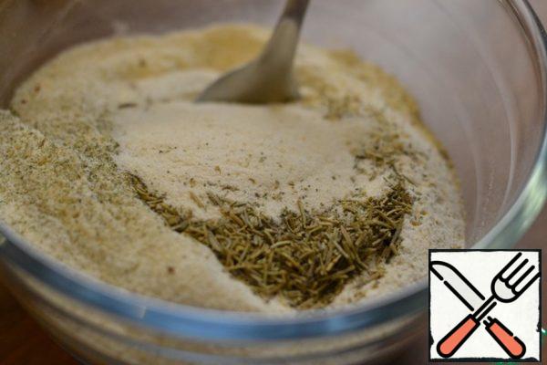 In a separate bowl, mix flour, salt and semolina.
Then add the yeast and the remaining 60 g of milk.
Mix it.
Add rosemary, thyme and black pepper.