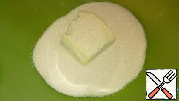 Rub the soft butter with sugar.
