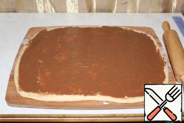 Brush with melted chocolate.
