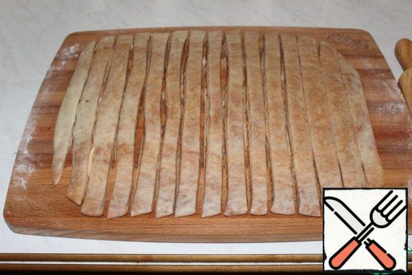 Cut into strips 1.5 cm wide .
