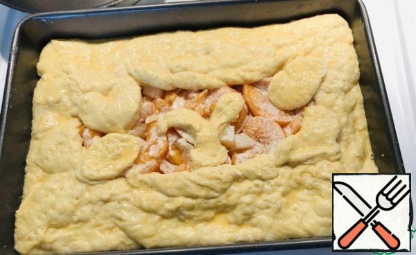 Roll out the dough with a rolling pin according to its shape, so that the dough sticks a little to your hands (lubricate your hands with vegetable oil) 2-2/ 5 mm thick. Place on a baking sheet suspended from the edges of the dough with the help of molds, distribute the filling, wrap the edges with the filling up. Mix the egg yolk with milk, brush the cake.
I'm not much of a designer, everything is on your imagination.
Immediately put the pie in the oven at 180 degrees for 35 minutes. Watch your technique.
The pie will rise well in the oven.
