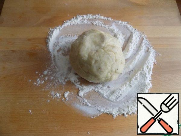 Then we spread it on the work surface.

