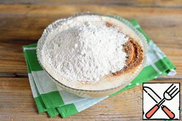 Add the sifted flour, yeast, salt, cocoa.
Knead the dough.

