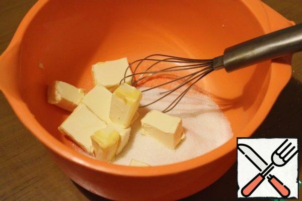 Cut the butter and beat it with sugar.
