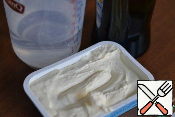 Add warm water, sunflower oil and cream cheese.
