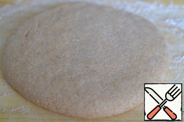 Put the dough that has come up on a cutting board.
